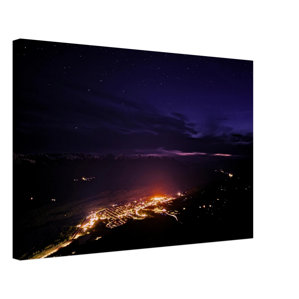 Mountain Town Lights Canvas Print – Canadian Rockies Northern Lights Wall Art — aurora borealis over a mountain town's glowing lights